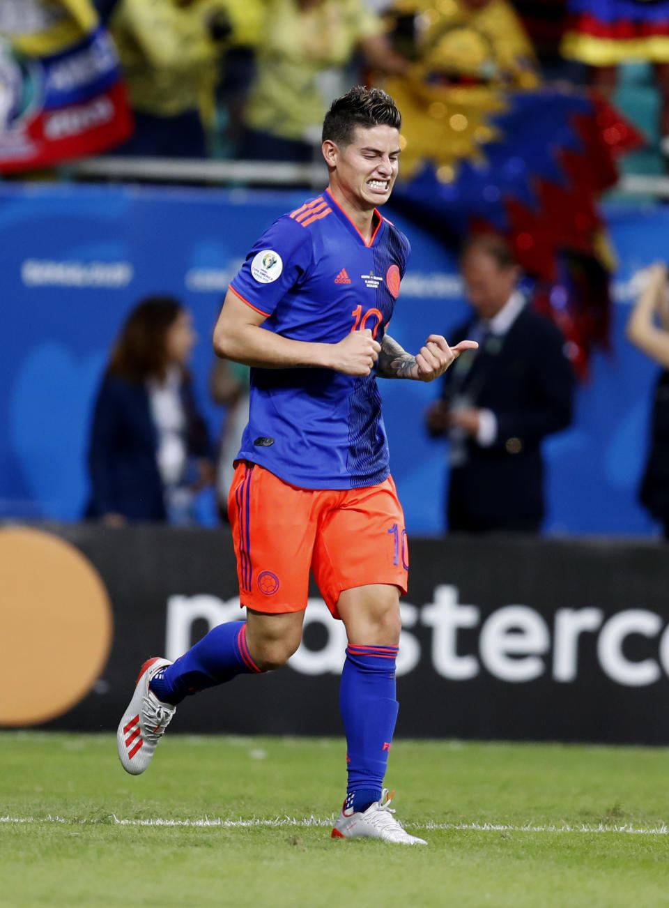 Colombia's James Rodriguez celebrates the second goal scored by Colombia's Duvan Zapata during a Copa America Group B soccer match against Argentina at the Arena Fonte Nova in Salvador, Brazil, Saturday, June 15, 2019. (AP Photo/Natacha Pisarenko)