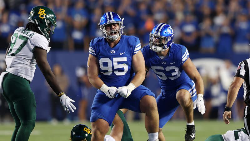 BYU defensive lineman Caden Haws celebrates a sack of Baylor quarterback Blake Shapen at LaVell Edwards Stadium in Provo on Saturday, Sept. 10, 2022. Haws is well familiar with Arkansas, having spent his growing-up years in the state.