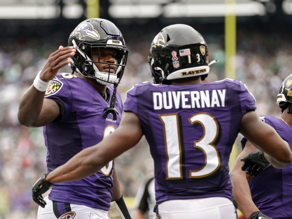 Devin Duvernay celebrates a touchdown with quarterback Lamar Jackson.