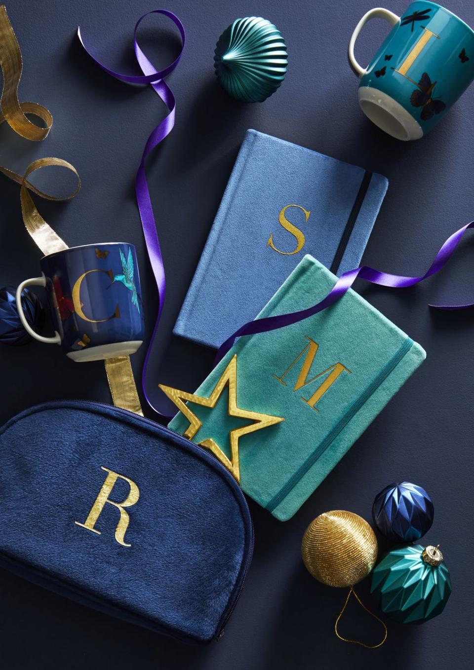 <p>Not sure what to gift your loved ones this year? Why not make it personal with Dunelm's range of monogrammed notebooks, mugs and cosmetic bags. In deep shades of teal and blue, they're the ultimate way to make a statement. </p>