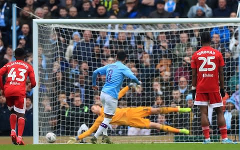 Manchester City's Ilkay Gundogan scores his side's first goal of the game from the penalty spot during the FA Cup fourth round match at the Etihad Stadium, Manchester - Credit: PA