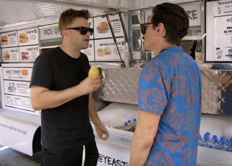 Schwartz and Sandoval talking at a food truck