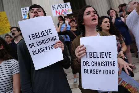 Protesters demonstrate on the steps of the U.S. Supreme Court building against the swearing in of Supreme Court nominee Justice Brett Kavanaugh inside the building in Washington, U.S. October 6, 2018. REUTERS/Jonathan Ernst