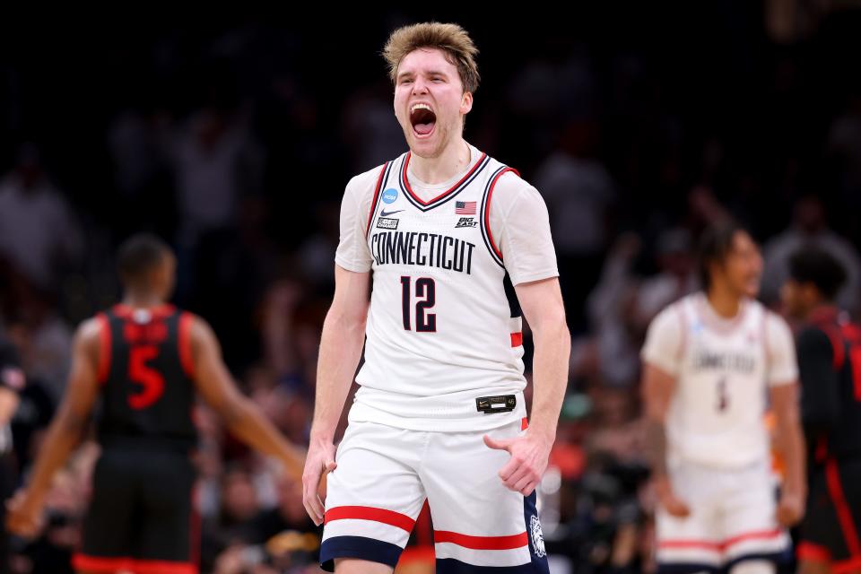 BOSTON, MASSACHUSETTS - MARCH 28: Cam Spencer #12 of the Connecticut Huskies celebrates against the San Diego State Aztecs during the second half in the Sweet 16 round of the NCAA Men's Basketball Tournament at TD Garden on March 28, 2024 in Boston, Massachusetts. (Photo by Michael Reaves/Getty Images)