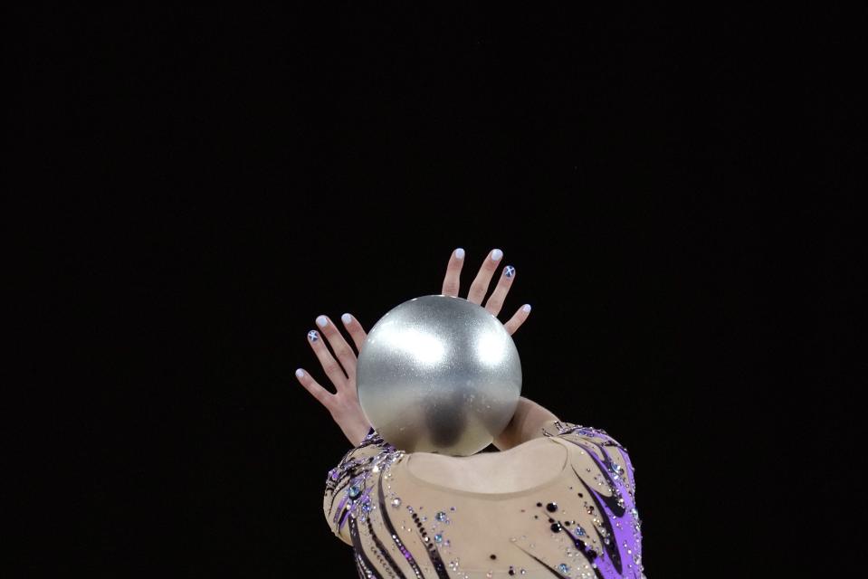 Louise Christie of Scotland performs with the ball in the Individual All-Around Rhythmic Gymnastics competition at the Commonwealth Games in Birmingham, England, Friday, Aug. 5, 2022. (AP Photo/Kirsty Wigglesworth)