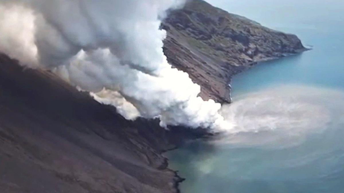 Mount Stromboli's lava flows into sea causing huge cloud of steam