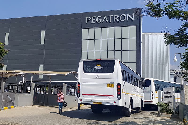 Employee buses enter the Pegatron facility near Chennai