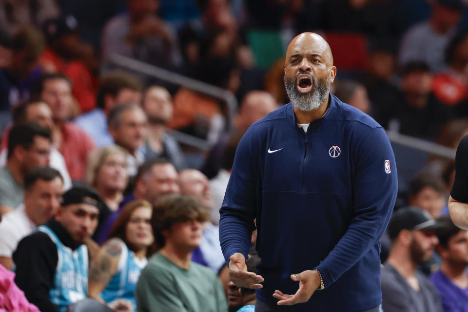 Washington Wizards head coach Wes Unseld Jr. directs his team against the Charlotte Hornets during the second half of an NBA basketball game in Charlotte, N.C., Wednesday, Nov. 8, 2023. (AP Photo/Nell Redmond)