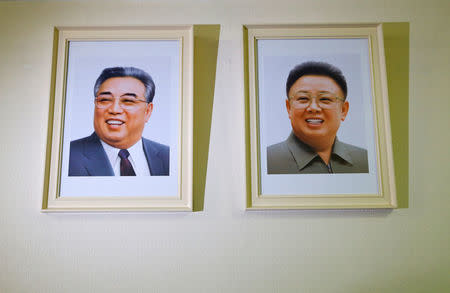 Portraits of Kim Jong Il and Kim Il Sung are displayed at the Permanent Mission of North Korea in Geneva, Switzerland, November 17, 2017. REUTERS/Denis Balibouse