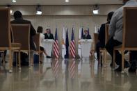 U.S. Secretary of State Mike Pompeo, left, Cypriot President Nicos Anastasiades make statements during a press conference at the Presidential Palace in Nicosia, Cyprus, Saturday, Sept. 12, 2020. Pompeo's lightning visit to Cyprus aimed to de-escalate a confrontation between Greece and Turkey over energy reserves in east Mediterranean waters and to affirm Washington's continued engagement in the tumultuous region four days after Russian Foreign Minister Sergey Lavrov pitched Moscow's offer to help ease tensions during his trip to the island nation. (AP Photo/Petros Karadjias, Pool)