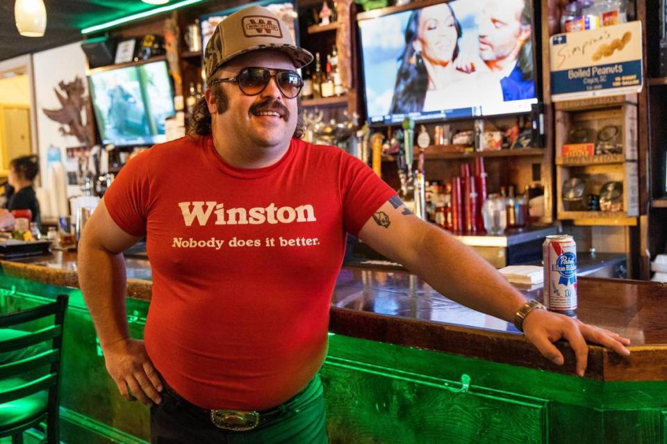Orry Lee, better known as the Cornbread Cowboi, gets lunch at Henry’s Restaurant & Bar in Cayce, South Carolina on Wednesday, May 3, 2023. His brand of southern comedy has earned him hundreds of thousands of followers on social media.