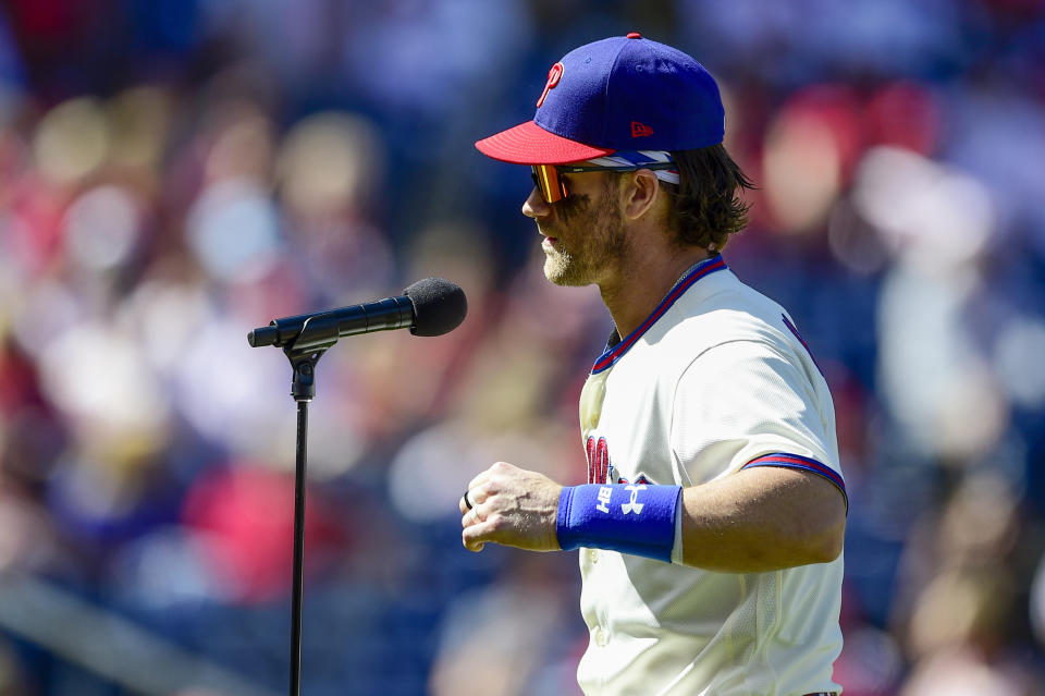 FILE - In this Sept. 26, 2021, photo, Philadelphia Phillies' Bryce Harper addresses the crowd before a baseball game against the Pittsburgh Pirates in Philadelphia. The 28-year-old Harper is doing it all — from sliding headfirst into home to win games to throwing fastballs from right field to home to save games — for the Phillies in their pursuit of the NL East crown. (AP Photo/Derik Hamilton, FIle)