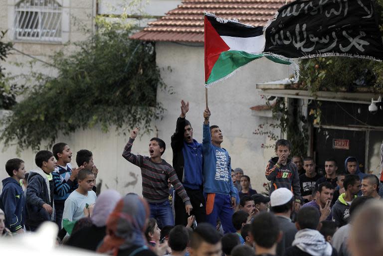 Palestinians demonstrate against new restrictions limiting access to the flashpoint Arab village of Abu Tur in East Jerusalem, the scene of recent clashes between youths and Israeli security forces