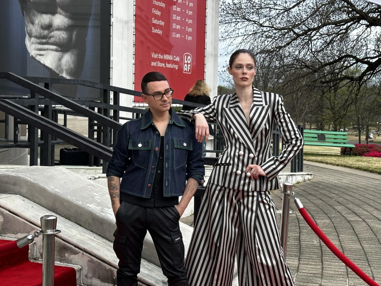 Project Runway mentor and notable fashion designer Christian Siriano poses with his close friend, Canadian model Coco Rocha, outside of the Brooks Art Museum of Memphis on the opening night of his exhibit, "People are People."