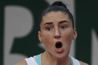 France's Elsa Jacquemot screams after scoring a point against Russia's Alina Charaeva in the junior women's final match of the French Open tennis tournament at the Roland Garros stadium in Paris, France, Saturday, Oct. 10, 2020. (AP Photo/Alessandra Tarantino)