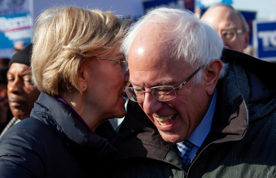 Democratic U.S. presidential candidate Sen. Elizabeth Warren laughs with fellow Democratic U.S. presidential candidate Sen. Bernie Sanders during the Martin Luther King Jr. (MLK) Day festivities in Columbia, South Carolina, U.S., January 20, 2020.  REUTERS/Sam Wolfe     TPX IMAGES OF THE DAY - RC2WJE9R8497
