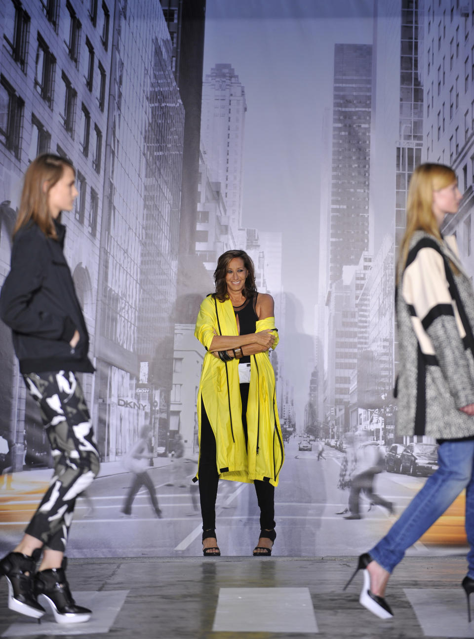 The DKNY Spring 2013 collection is modeled during Fashion Week in New York on Sunday, Sept. 9, 2012. (AP Photo/Stephen Chernin)