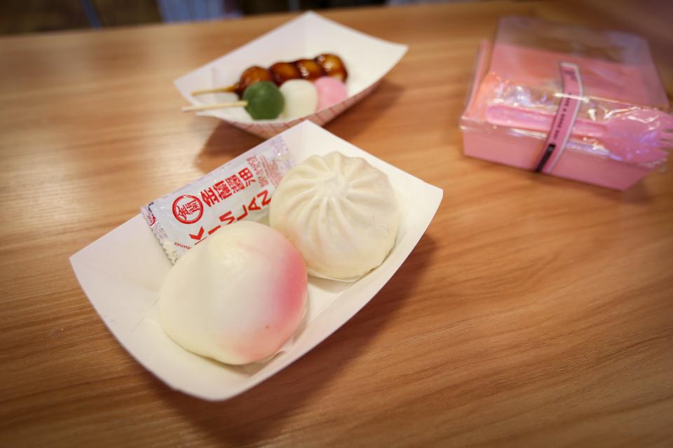 A plate of steamed buns, front, at Lucky Cat Boba Tea and Tayaki on Wednesday, Aug. 16, 2023.