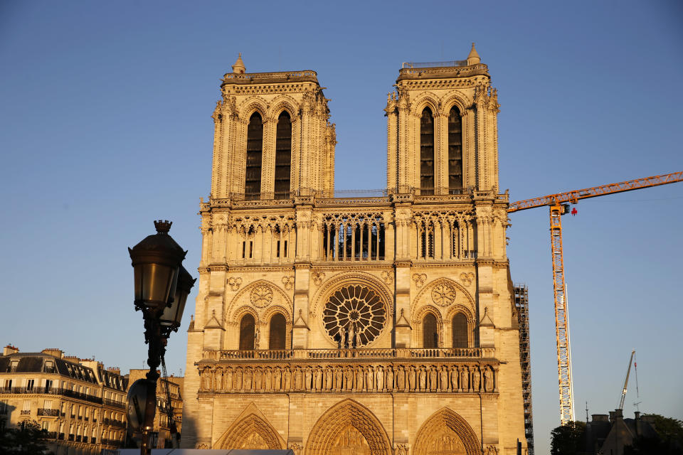 Notre-Dame cathedral is seen at sunset after repair work stops due to the coronavirus (COVID 19) outbreak one year after fire ravaged the emblematic monument as the coronavirus lockdown continues on April 14, 2020 in Paris, France. April 15 marks the first anniversary of the fire at Notre Dame destroying many parts of the Gothic cathedral. The coronavirus pandemic has spread to many countries across the world, claiming over 125,000 lives and infecting over 1.9 million people. (Photo by Chesnot/Getty Images)