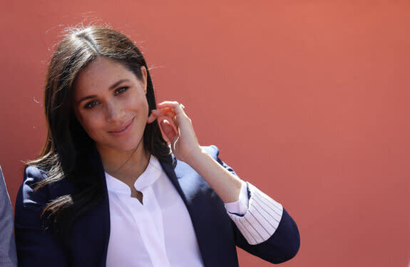 The Duchess of Sussex attends an Investiture for Michael McHugo the founder of 'Education for All', where he received an MBE, during their visit to the original 'Education For All' boarding house in Asni Town, Atlas Mountains on the second day of her tour of Morocco with the Duke of Sussex.