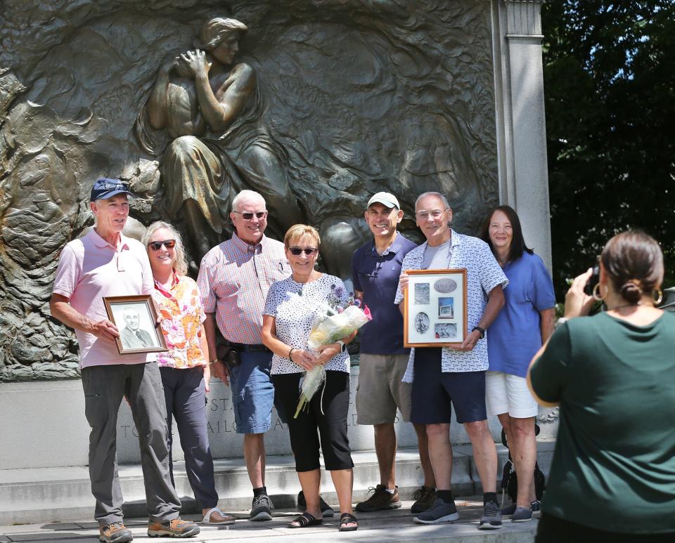 Family of the late James Russo gather at the Maine Sailors and Soldiers Memorial in Kittery, Wednesday, July 27, 2022. Russo was the model for the baby in the statue. From left are Russo's son, James Alan Russo and his wife Susan, Cindi Russo-Smith and her husband Dennis Smith, nephew Don Derosa, son Barry Russo and his wife Susan. Taking the photo is Suzanne Esposito of the  town of Kittery staff.