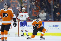 Philadelphia Flyers' Joel Farabee, right, celebrates past Philippe Myers, left, and Montreal Canadiens' Ben Chiarot after scoring a goal during the first period of an NHL hockey game, Thursday, Jan. 16, 2020, in Philadelphia. (AP Photo/Matt Slocum)