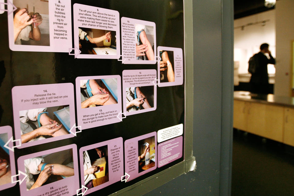 A poster shows how to use a syringe safely inside a safe injection site in Vancouver, Canada, on Aug. 23, 2006. (Photo: Andy Clark/Reuters)