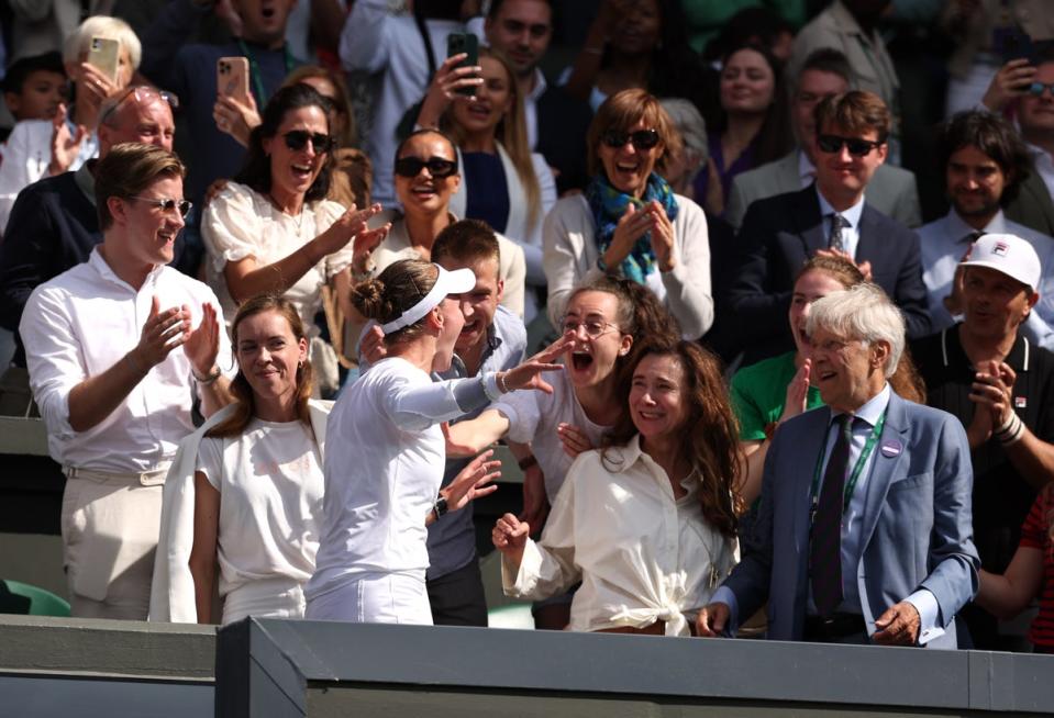 Krejcikova celebrates with her team after claiming her second singles grand slam (Getty)