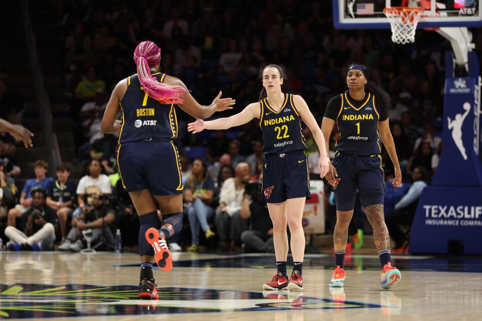 ARLINGTON, TEXAS - MAY 03: Caitlin Clark #22 and Allyah Boston #7 of the Indiana Fever celebrate while playing the Dallas Wings during a pre season game at College Park Center on May 03, 2024 in Arlington, Texas. (Photo by Gregory Shamus/Getty Images)