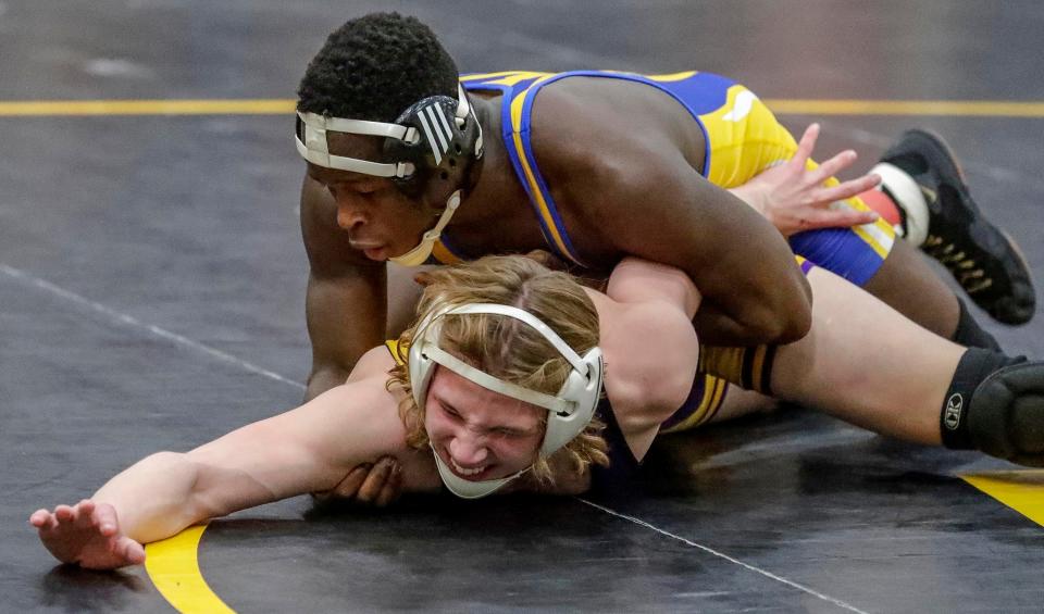 Campbellsport's Ostin Blanchard, top, puts pressure on Sheboygan Falls' Jake Shaver during a 126-pound match at a WIAA wrestling sectional last season in Waupun.