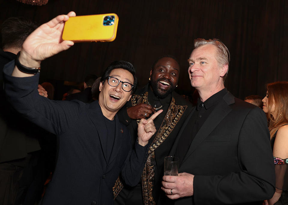 Ke Huy Quan Brian Tyree Henry and Christopher Nolan take a selfie at MPTFs Night Before party