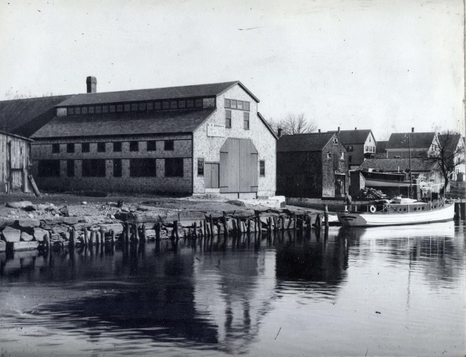 E.H. Brown's Boat Building Shop, pictured c. 1908, was located at 87 E. Water St. The building was destroyed by fire on June 30, 1936.