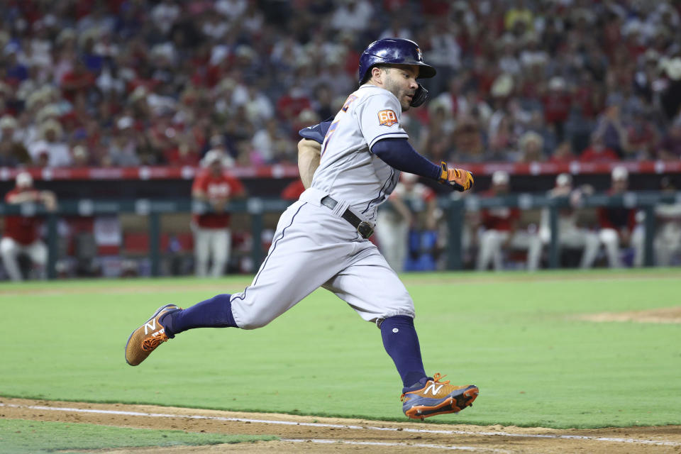 Houston Astros second baseman Jose Altuve rounds first after hitting for a double during the eighth inning of a baseball game against the Los Angeles Angels Saturday, Sept. 3, 2022, in Anaheim, Calif. The Angles won 2-1. (AP Photo/Raul Romero Jr.)