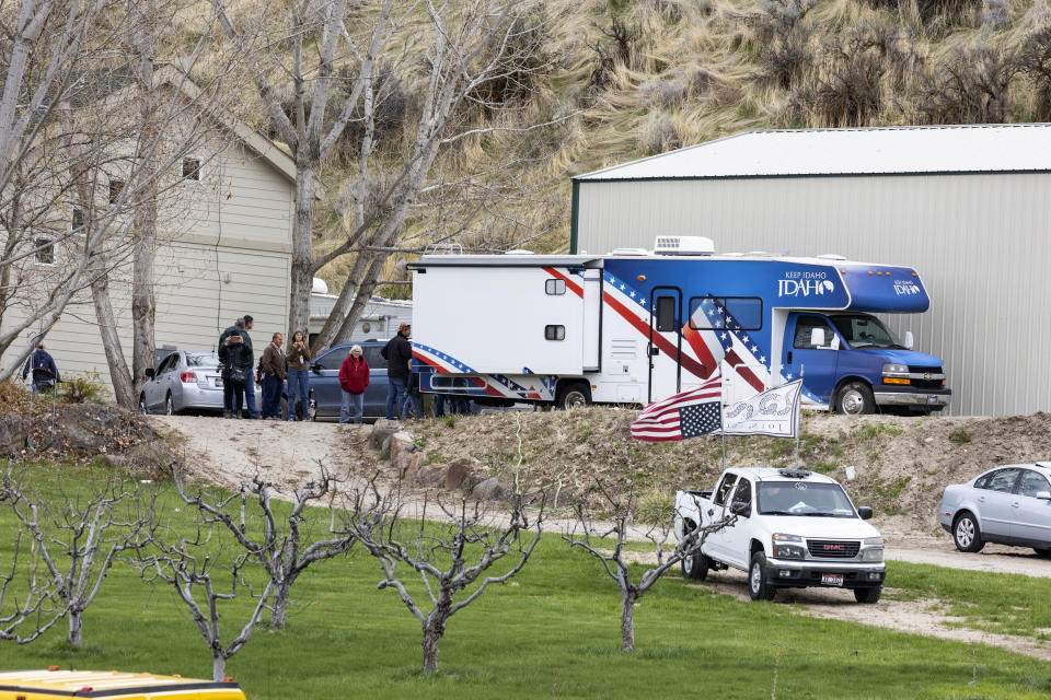 FILE - Supporters gather on the property of former Idaho gubernatorial candidate and far-right activist Ammon Bundy after law enforcement officers attempted to arrest Bundy on a misdemeanor warrant for contempt of court earlier in the day, on April 24, 2023, in Emmett, Idaho. A jury on Monday, July 24, 2023, awarded an Idaho hospital more than $50 million in damages in a defamation case the institution brought against far-right activist Ammon Bundy and others. (AP Photo/Kyle Green, File)