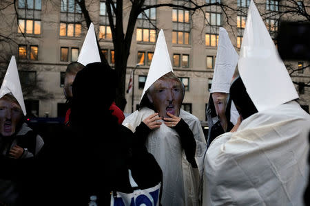 Anti-Trump demonstrators organized by RefuseFascism.org gather at McPherson Square in Washington January 18, 2017. REUTERS/James Lawler Duggan