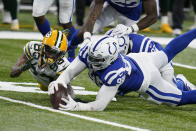 Green Bay Packers' Marquez Valdes-Scantling (83) fumbles a catch during the overtime of an NFL football game against the Indianapolis Colts, Sunday, Nov. 22, 2020, in Indianapolis. Colts' DeForest Buckner (99) recovered the fumble. (AP Photo/Michael Conroy)