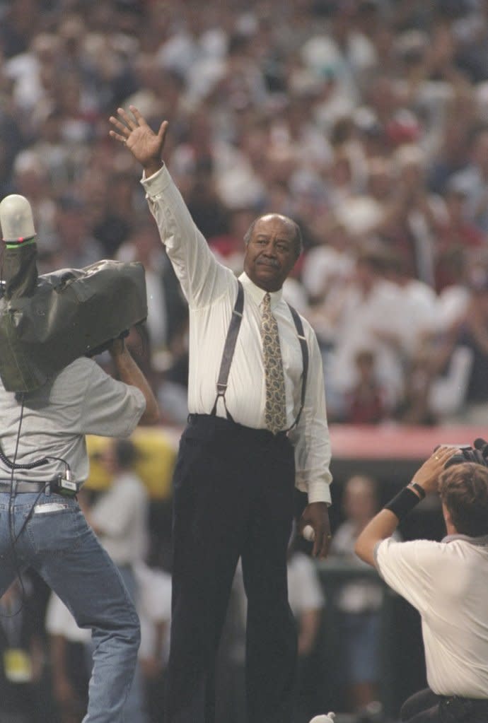 Doby throws the first pitch at the 1997 All-Star game in Cleveland, OH. Getty Images