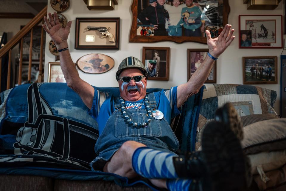 Die-hard Detroit Lions Superfan Ron "Crackman" Crachiola, 69, of Macomb Township sits on his couch at his home on March 3, 2021. He started attending Lions games at Tigers Stadium with his father and this past opener and Thanksgiving Day ritual of attending the games was his first time missing them in his over 40 years of being a season ticket holder.