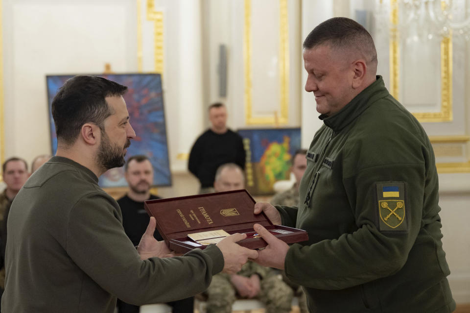 In this photo provided by the Ukrainian Presidential Press Office, Ukrainian President Volodymyr Zelenskyy, left, award former Commander-in-Chief of Ukraine's Armed Forces Valerii Zaluzhnyi during an awarding ceremony in Kyiv, Ukraine, Friday, Feb. 9, 2024. (Ukrainian Presidential Press Office via AP)