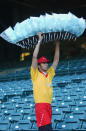 Cotton Candy vendor Nick Negron carries his candy in front of empty seats on the eve of a Major League Baseball strike before the game between the Tampa Bay Devil Rays and the Anaheim Angels at Edison Field on August 29, 2002 in Anaheim, California. (Photo by Harry How/Getty Images)
