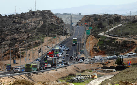 Vehicles are seen near the scene of a shooting attack near Ramallah in the Israeli-occupied West Bank December 13, 2018. REUTERS/Mohamad Torokman