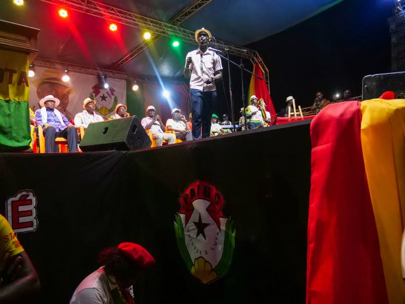 A man introduces speakers during the campaign rally for presidential candidate Domingos Simoes Pereira in Bissau