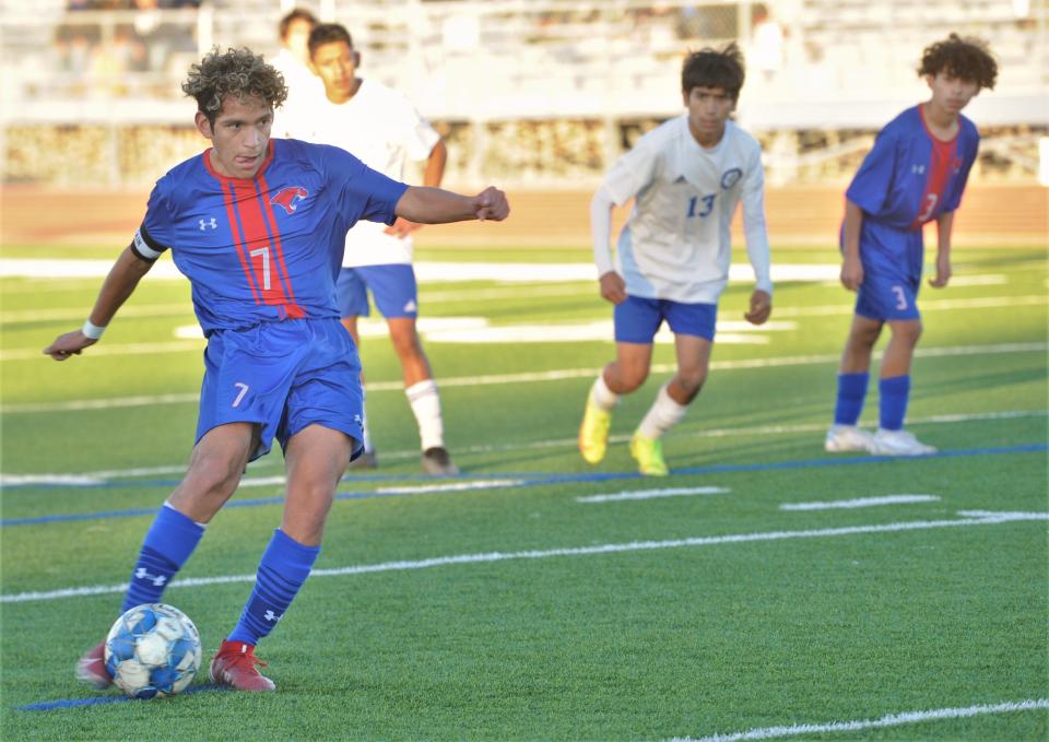 Cooper's Ramiro Padilla kicks a penalty kick to put the Cougars up 1-0 in the first half. Cooper beat the Chiefs 4-2 in the nondistrict game Friday, Jan. 29, 2022, at the Cooper High School field. Padilla scored twice and assisted on another goal.