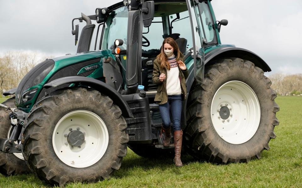 The Duchess of Cambridge steps from a tractor during a visit to Manor Farm in Little Stainton - Owen Humphreys/PA