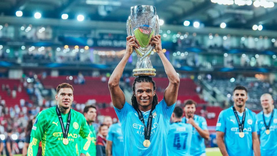 SUPER TROOPER; Nathan Ake holds the UEFA Super Cup trophy aloft.