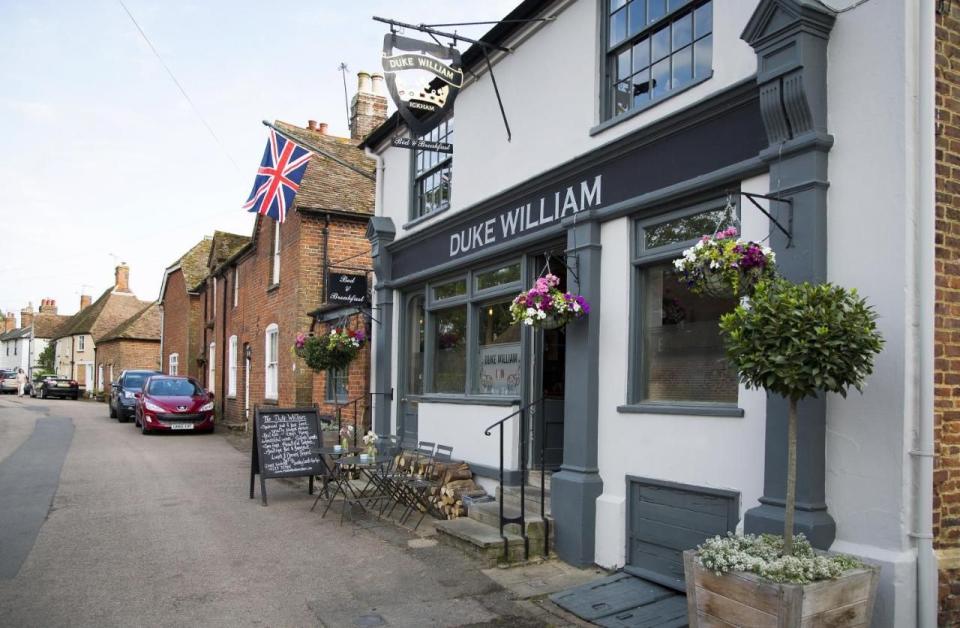 <p>Ickham is a quintessential Kentish village complete with thatched cottages in an idyllic countryside location. And what quaint English village would be complete without a cosy pub?</p><p><a href="https://www.goodhousekeepingholidays.com/offers/kent-ickham-duke-william-hotel" rel="nofollow noopener" target="_blank" data-ylk="slk:The Duke William;elm:context_link;itc:0;sec:content-canvas" class="link ">The Duke William</a> is a supremely snug inn with low beamed ceilings, a roaring wood fire, and candles flickering in old ceramic beer jugs. One of the owners is famous chef Mark Sargeant, so, along with real ales and pub quizzes, you can expect excellent food.</p><p>Check in for the night and enjoy a good night's sleep in a king-size bed, followed by a cooked breakfast in the pub. Or, if you want a lie-in, ask for a breakfast hamper to be delivered to your room.</p><p><a class="link " href="https://www.goodhousekeepingholidays.com/offers/kent-ickham-duke-william-hotel" rel="nofollow noopener" target="_blank" data-ylk="slk:READ OUR REVIEW;elm:context_link;itc:0;sec:content-canvas">READ OUR REVIEW</a></p>