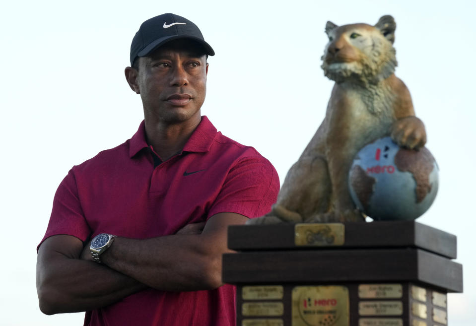 Tiger Woods stands next to the trophy after Norway,'s Viktor Hovland won the Hero World Challenge PGA Tour at the Albany Golf Club in New Providence, Bahamas, Sunday, Dec. 4, 2022. (AP Photo/Fernando Llano)