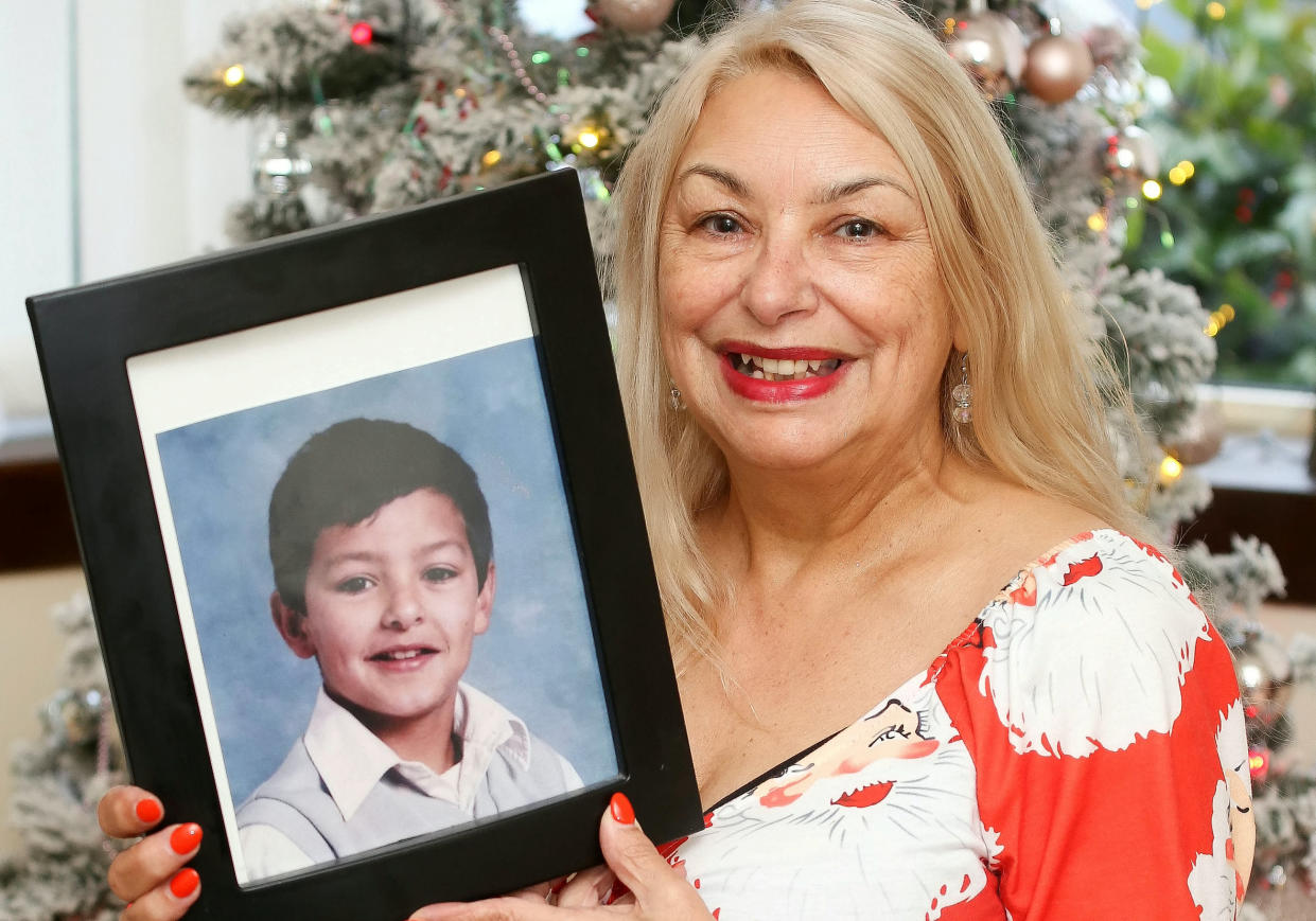 Joyce Curtis with a photo of her son Nicholas. (SWNS)