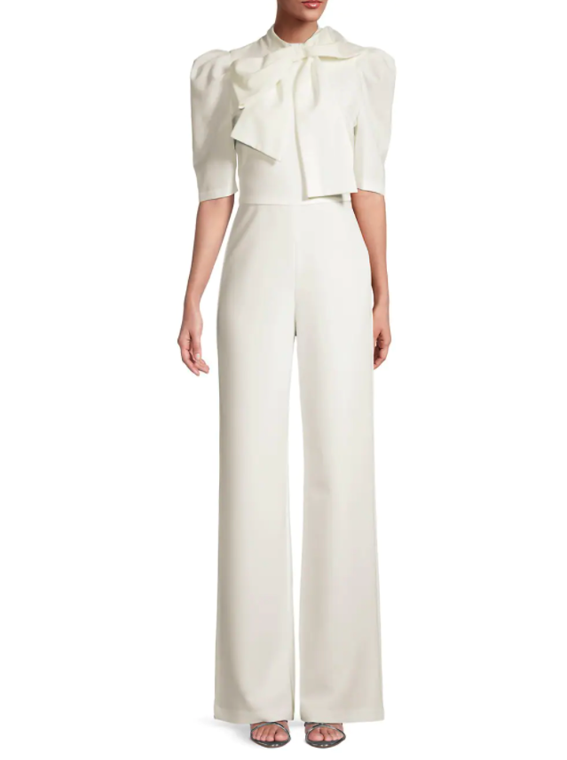 Black Halo Ara Bow Puff-Sleeve Jumpsuit. (photo via Saks Fifth Avenue)