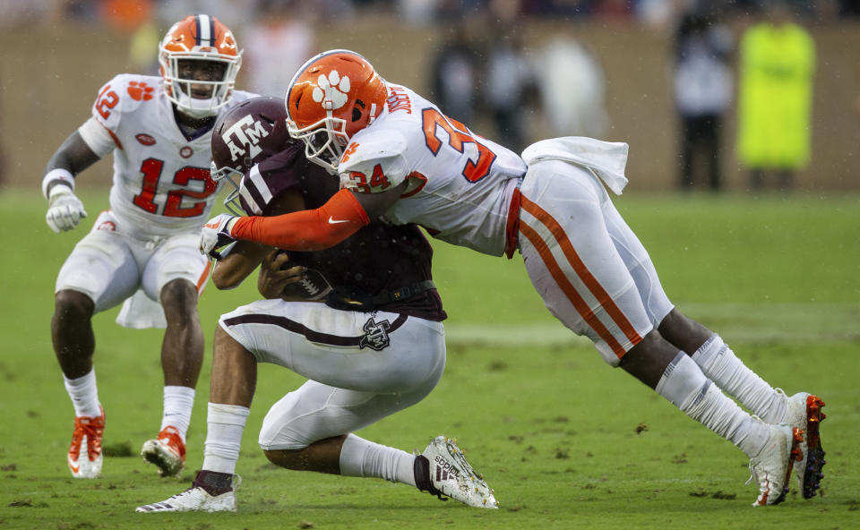 Texas A&M quarterback Kellen Mond (11) is stopped for a loss by Clemson linebacker Kendall Joseph (34) during the first half of an NCAA college football game Saturday, Sept. 8, 2018, in College Station, Texas. (AP Photo/Sam Craft)